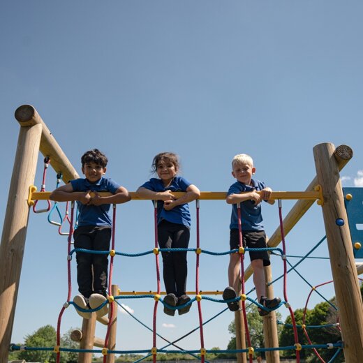 Elmhurst school students climbing structure compressed